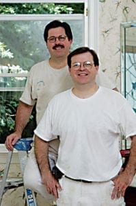 Men laying new hardwood flooring
