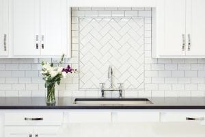 White kitchen set up with black countertop