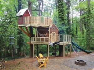 Red and exposed wood three story tree house