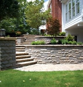Build a hardscape using brick, concrete and stone