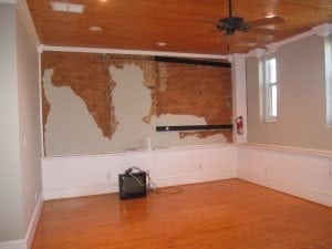 Men laying new hardwood flooring