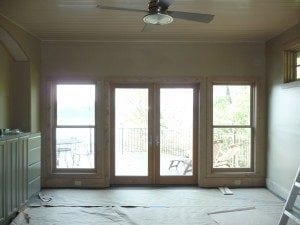 Men laying new hardwood flooring