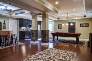 Basement remodel showing games room, kitchen and bar