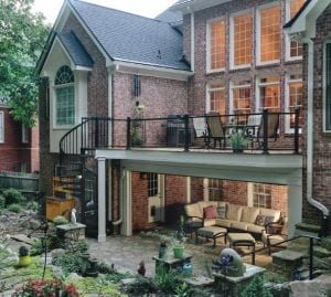 Large upper and under deck area with black handrail and wooden deck