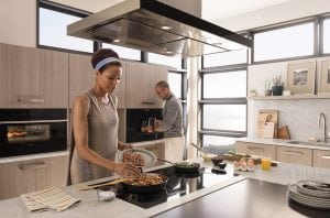 Elegant kitchen design with African-American couple using Wolf Appliances
