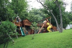 Treehouse with fort, slides and swings