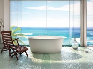 Oval freestanding tub, beautiful tile work that looks like the ocean