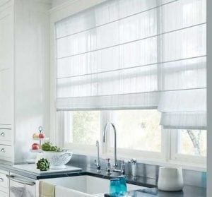 Sheer white window curtains in kitchen setting