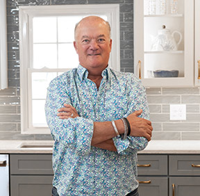 Make Galey standing in a kitchen